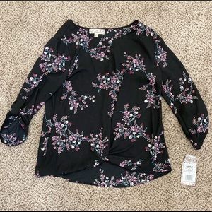 Black blouse with flowers on it